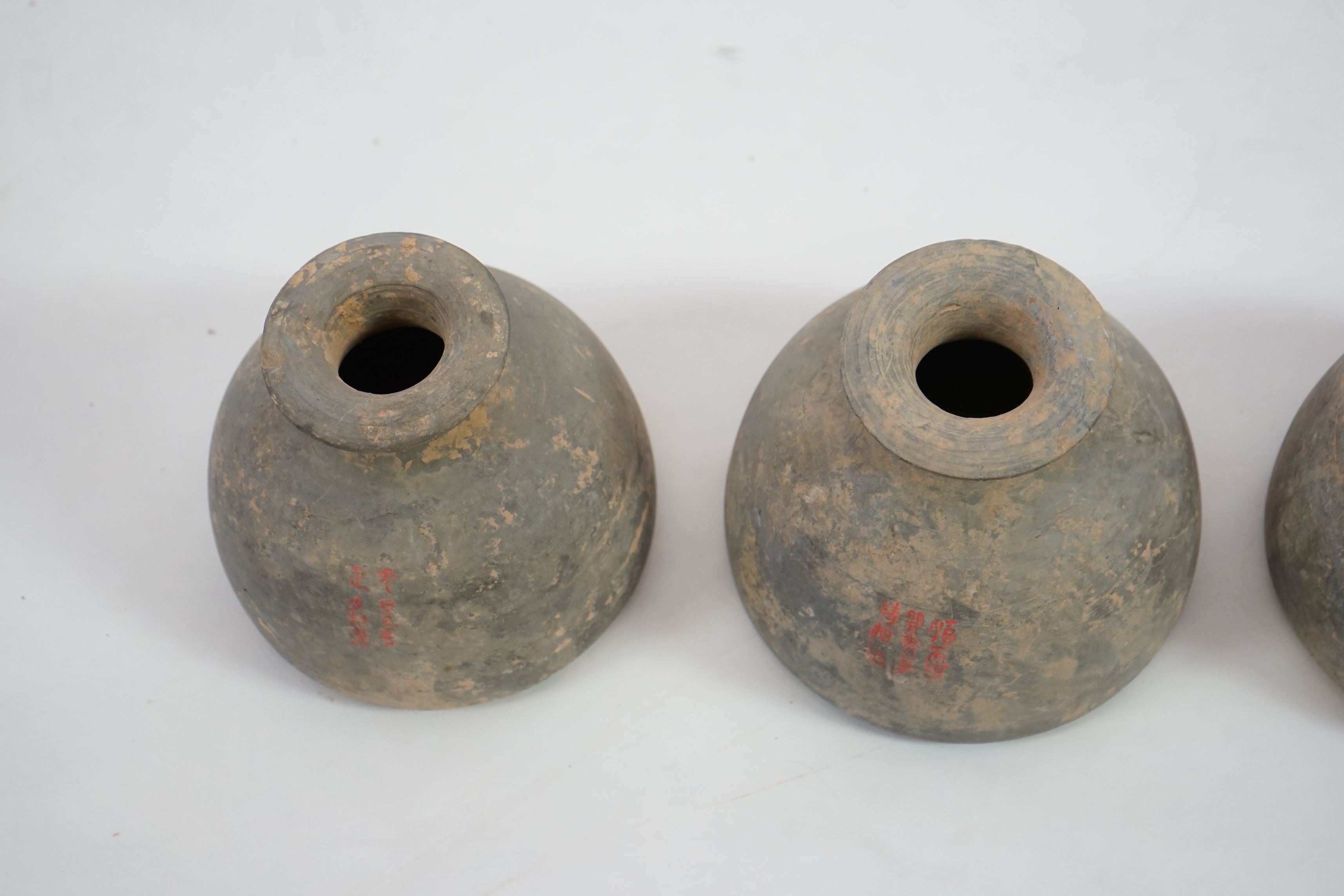 Four very rare Chinese inscribed pottery jars, Han dynasty